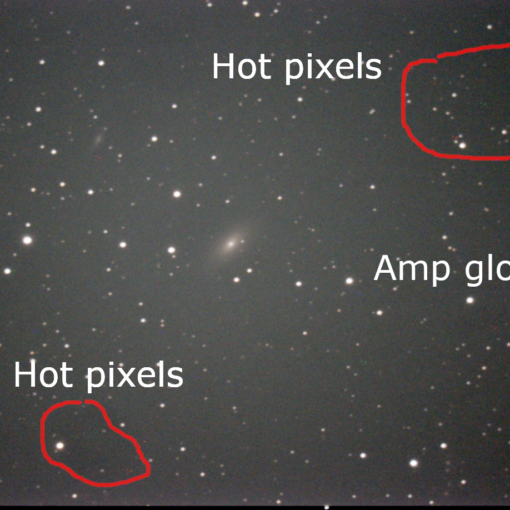 Picture of galaxies with image aberations like amplifier glow and hot pixels highlighted.